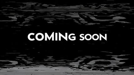 White text 'coming soon' on black background, glitch effect. Teaser announcement.