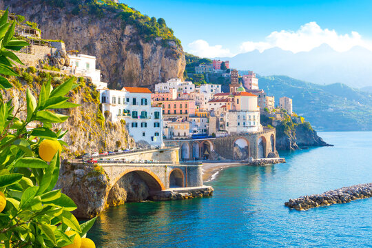 Beautiful view of Amalfi on the Mediterranean coast with lemons in the foreground, Italy