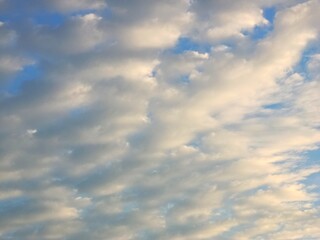 Defocused view of white clouds on blue sky background 