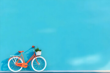 Fototapeta premium Photo Minimalist Orange Bicycle Basket Plant Blue Wall Background