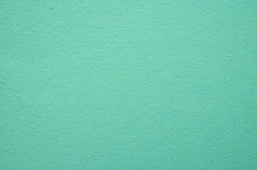 Full frame shot of light green paper sheet texture and background.