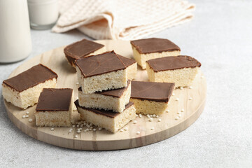 Delicious puffed rice bars on gray textured table, closeup