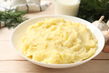 Delicious mashed potato on white wooden table, closeup