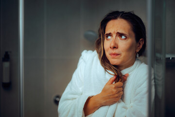 Woman Feeling Cold in the Shower Not having Hot Water at Home. Unhappy lady having plumbing...