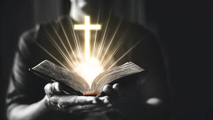 Church pray Jesus christian on black white concept with holy book and The cross is glowing golden.