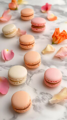 Obraz premium Photo: Colorful Macarons and Flower Petals on Marble