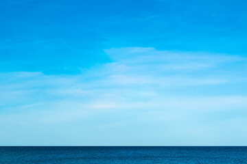 Nature of the beach and sea Summer with sunshine, sandy beaches, clear blue waters sparkling against the blue sky. On an island with good ecology and environment Background for summer vacation