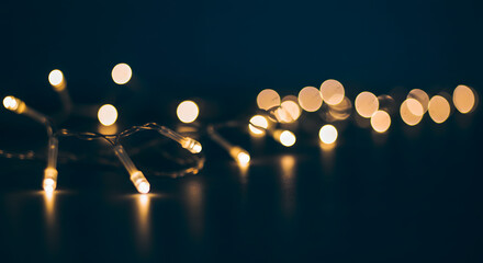 Warm yellow string lights festive bokeh dark background night photography on transparent background
