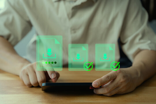 Person using a mobile phone with glowing green download icons and progress indicators, representing data transfer, cloud storage, file management, and digital technology.
