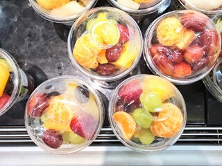 Pre packed cut fruit on sale in a supermarket. Pre packed cut fruit on sale on the shelf of a...