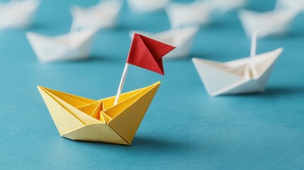 Colorful origami paper boats on blue water surface with red flag symbolizing creativity and uniqueness in art