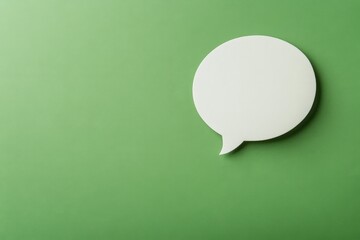 A white speech bubble rests on a plain green background