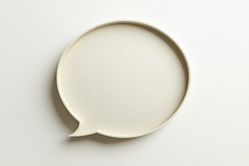 A single beige speech bubble floats above a white surface