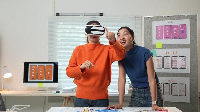 Ux designers testing virtual reality interface in modern office