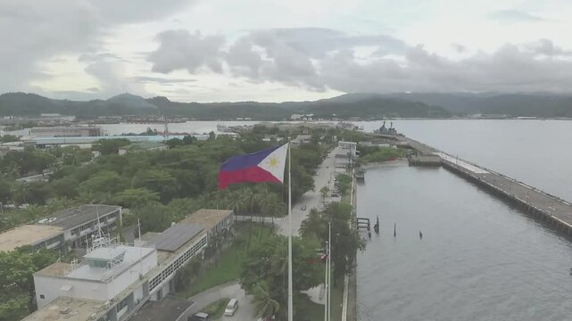 Subic Bay in Olongapo, Philippines, is a picturesque deep-water harbor known for its stunning beaches, vibrant marine life, water sports, and historical significance as a former U.S. naval base.
