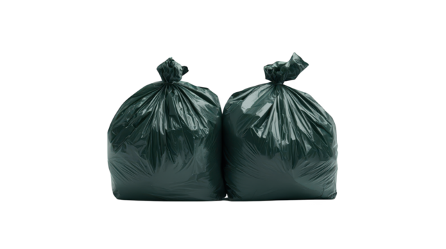 Two black garbage bags, a dark studio still life of waste disposal 