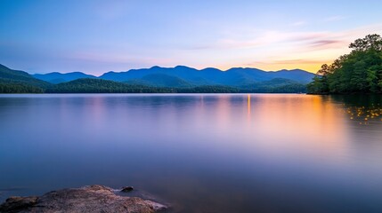 Fototapeta premium Serene sunset over mountain lake