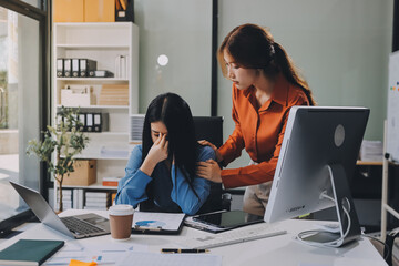 Asian women are stressed or has sore throat at office while working on laptop, Tired asian businesswoman with headache at office, feeling sick at work, copy space