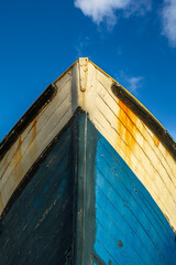 Bow of a timber fishing boat undergoing repairs