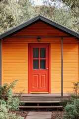 Fototapeta premium Small Orange House With Red Door