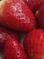Fresh red strawberries background and texture 