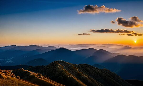 Mountain Majesty: Blue and Orange Peaks Beneath a Sunset Sky
