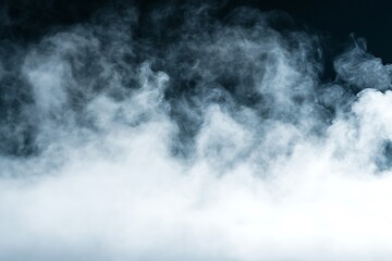 Fototapeta premium White cloud of smoke on a black background. Close-up.