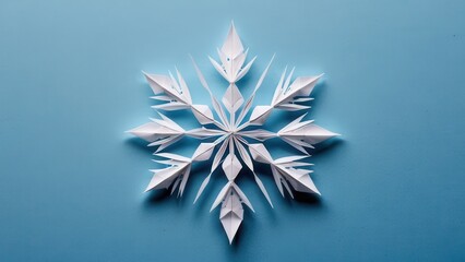  delicate craftsmanship of a paper snowflake artfully arranged against a soft blue background