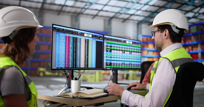 The Manager Analyzing Data on His Desktop