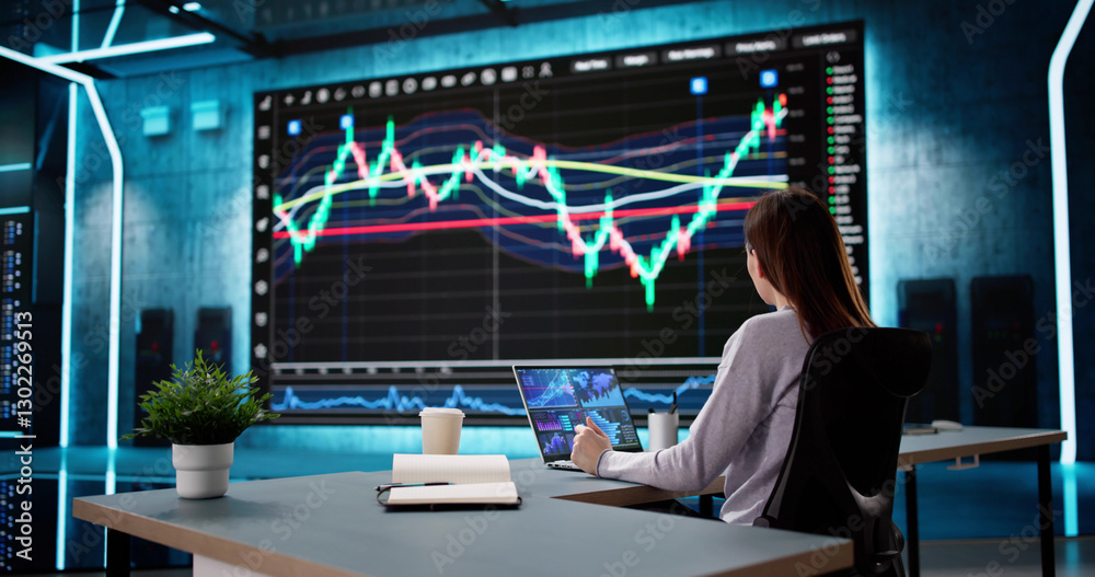 Aufkleber female stock analyst analyzing data on computer screens