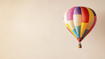 Obraz premium Colorful hot air balloon floating against soft background, evoking joy and adventure