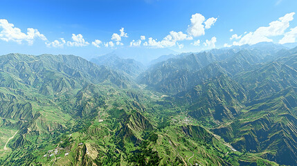 Fototapeta premium Aerial valley view with green mountains, agricultural fields, distant village, and cloudy sky