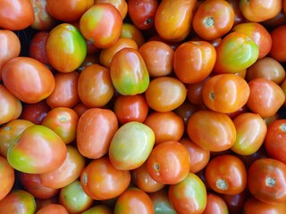 red tomatoes background. Fresh red tomatoes sell at the market. Tomato texture