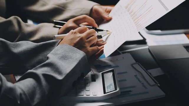 HR team conducting salary benchmarking analysis in a corporate setting