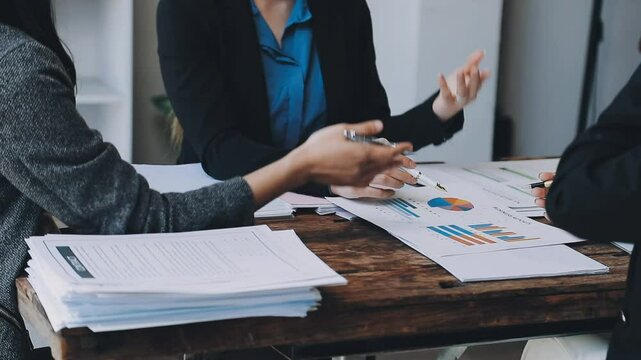 HR team conducting salary benchmarking analysis in a corporate setting
