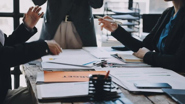HR team conducting salary benchmarking analysis in a corporate setting