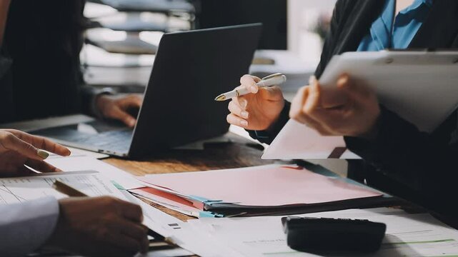 HR team conducting salary benchmarking analysis in a corporate setting