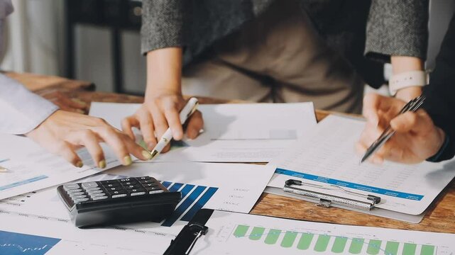 HR team conducting salary benchmarking analysis in a corporate setting