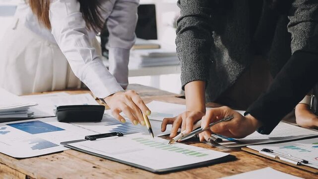 HR team conducting salary benchmarking analysis in a corporate setting