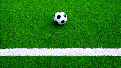 Soccer Ball on a Green Grass Field with White Boundary Line