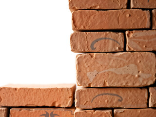 Obraz premium A section of an old brick wall with a jagged broken edge, revealing white space. Generative AI