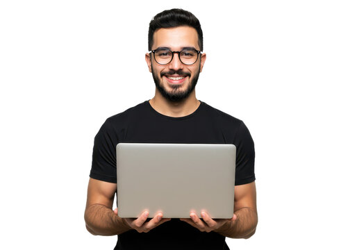 A young man holding a silver laptop in both hands and smiling directly at the camera