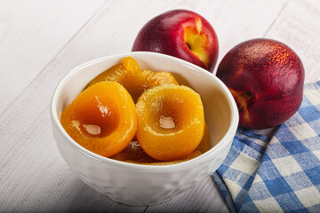 Canned peaches with sweet syrope