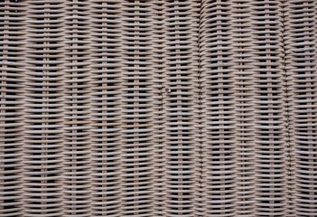 Abstract Wicker Weave Pattern: Brown, Grey, Beige, and Black Tones Capturing the Essence of an Old Wooden Wicker Armchair in a Unique Woven Design, Perfect for Textural Backgrounds.

