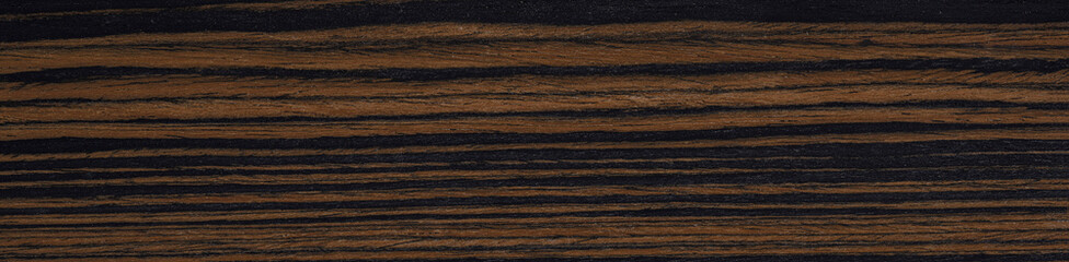 Contrasting waves of coffee and noir dance across this striking macassar ebony veneer, a testament...