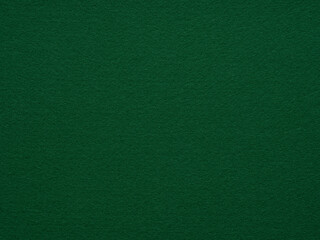 An emerald green felt surface that embodies the lush vibrancy of a dense forest, symbolizing growth...