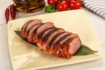 Sliced duck breast baked with cherry