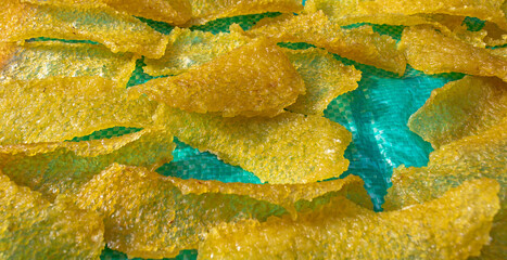 Manihot Esculenta (Cassava Chips) Drying on Blue Tarp Under Sunlight in Traditional Village