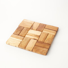 Handmade Wooden Coaster puzzle With an Intricate Patchwork Design on a Neutral Background