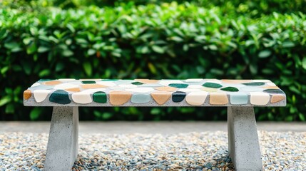 Construction Glass Aggregates Concept, Colorful Outdoor Bench Made with Concrete and Mixed Materials Surrounded by Lush Greenery in a Park Setting